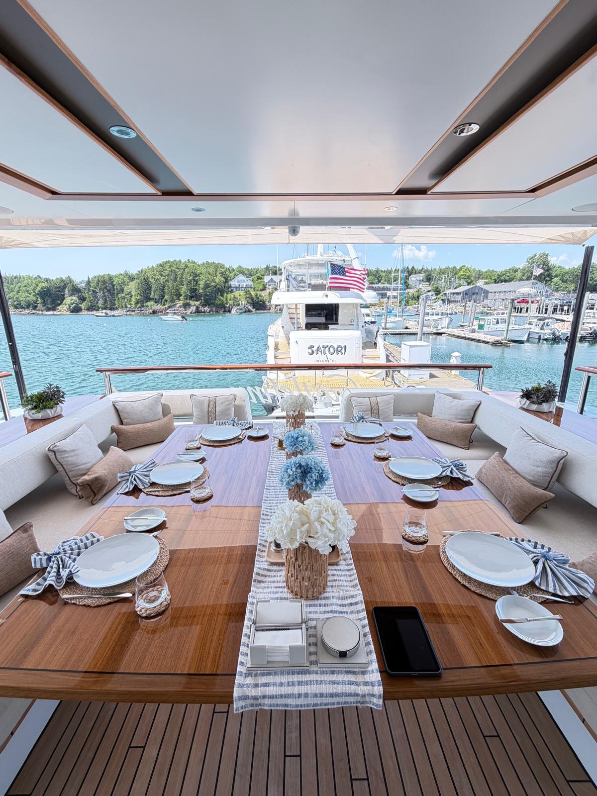 Alfresco yacht dining table prepared for eight guests