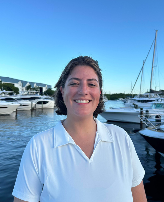 Me in yacht uniform at a marina