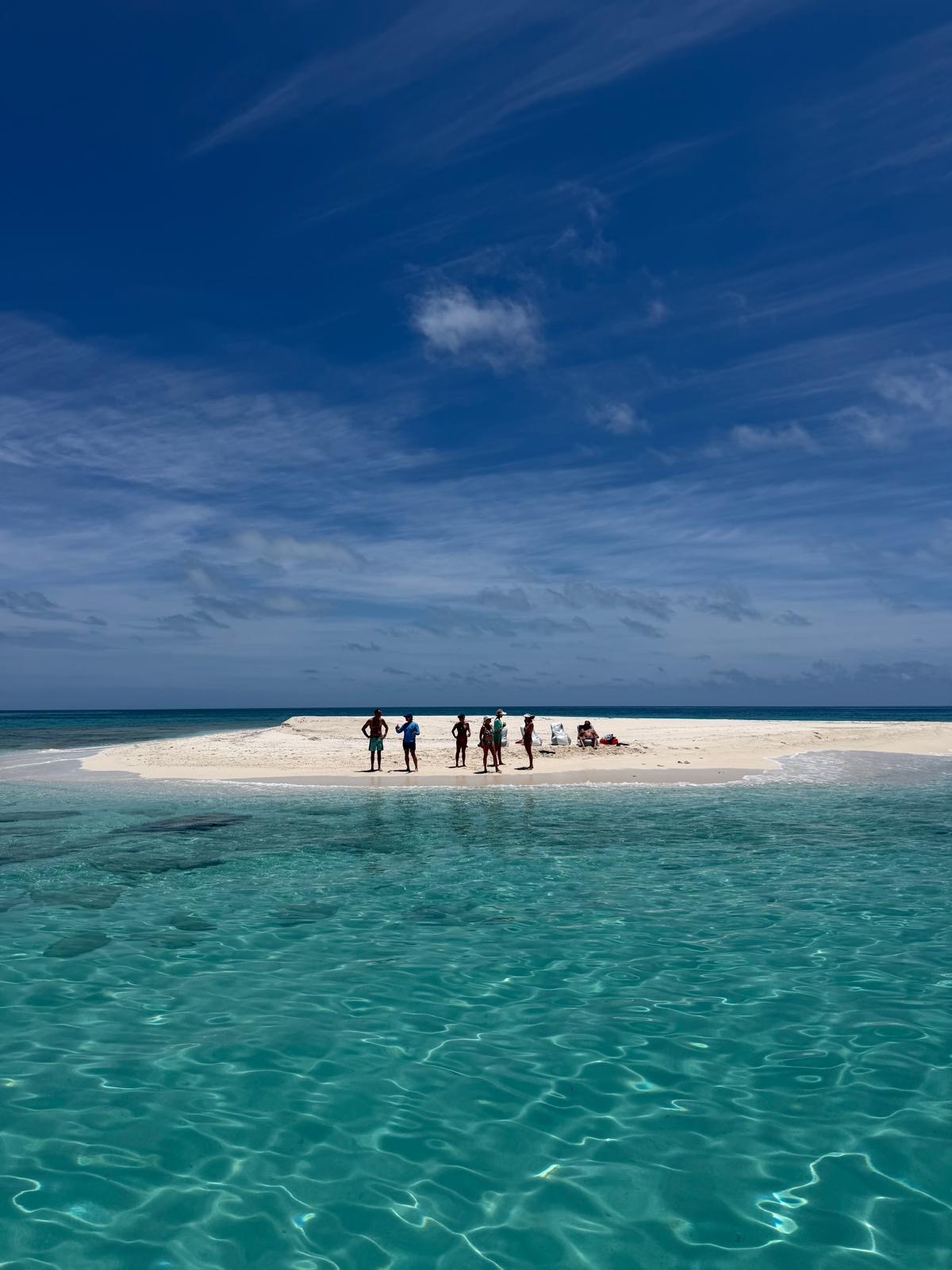 White sandbar surrounded by turquoise water