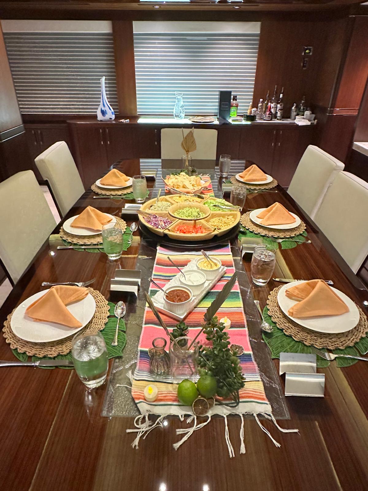 Colourful themed dinner setting aboard a yacht